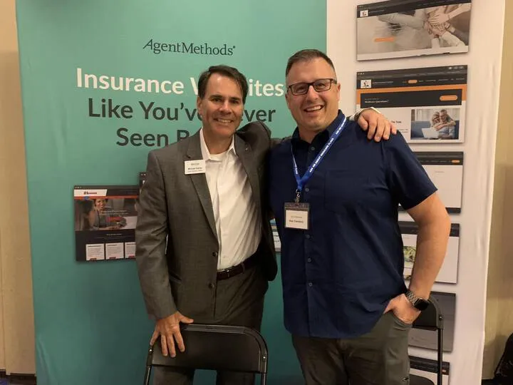 Two AgentMethods team members at the trade show booth