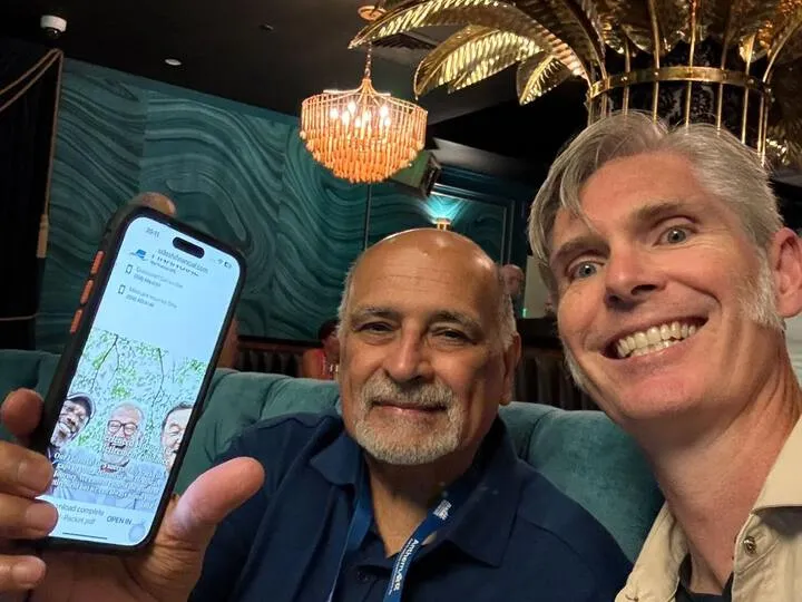 An agent and an AgentMethods team member reviewing a site on a phone